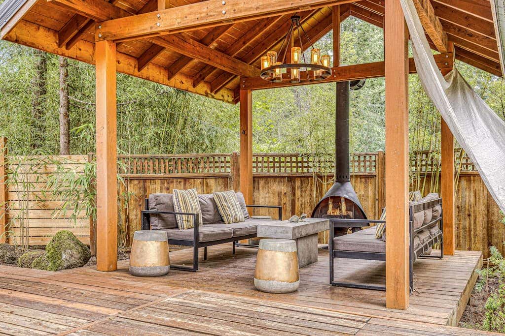 Dog-friendly home with hot tub, shared pool, firepit, fireplace, & river access