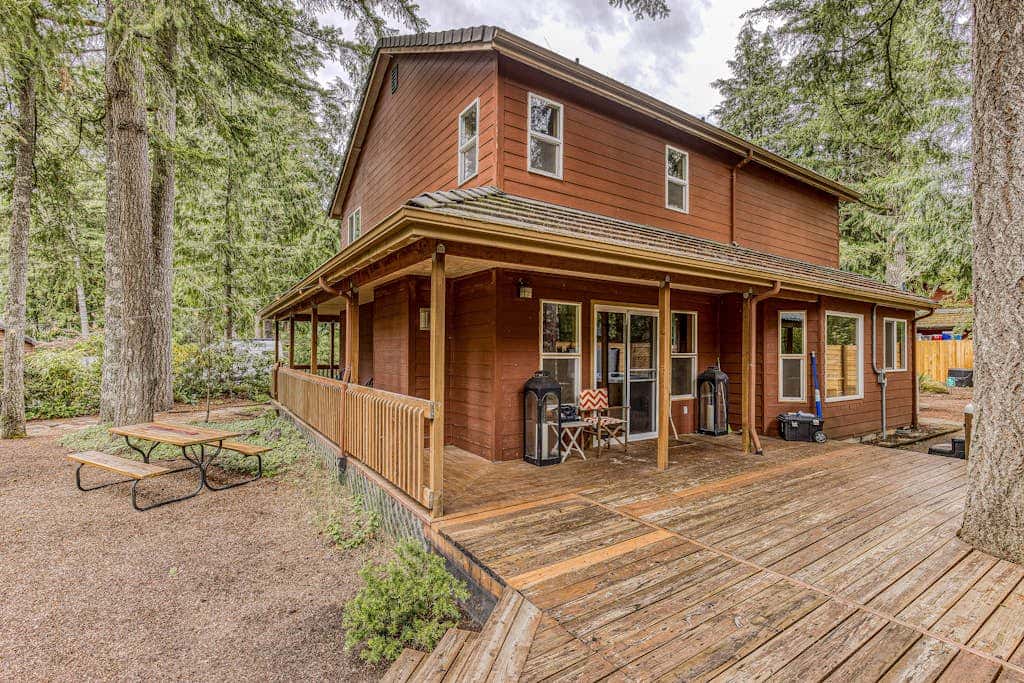 Dog-friendly home with hot tub, shared pool, firepit, fireplace, & river access