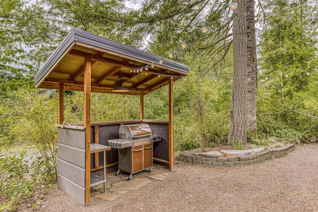 Dog-friendly home with hot tub, shared pool, firepit, fireplace, & river access