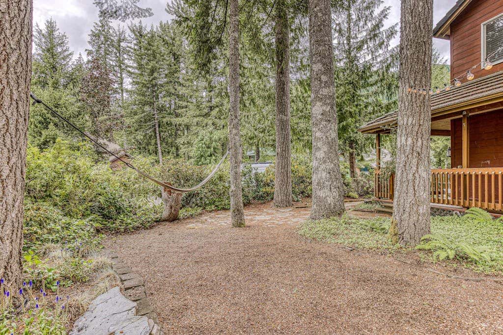 Dog-friendly home with hot tub, shared pool, firepit, fireplace, & river access