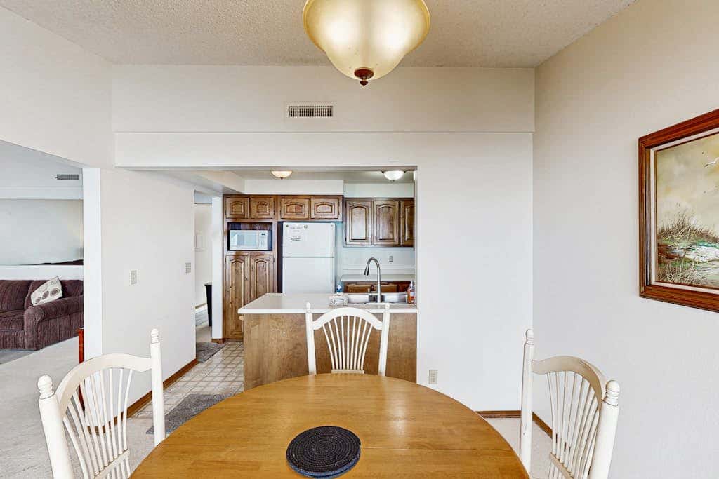 Sweeping Oceanfront Views Await Tranquil Condo with Balcony, Beach Access, W&D