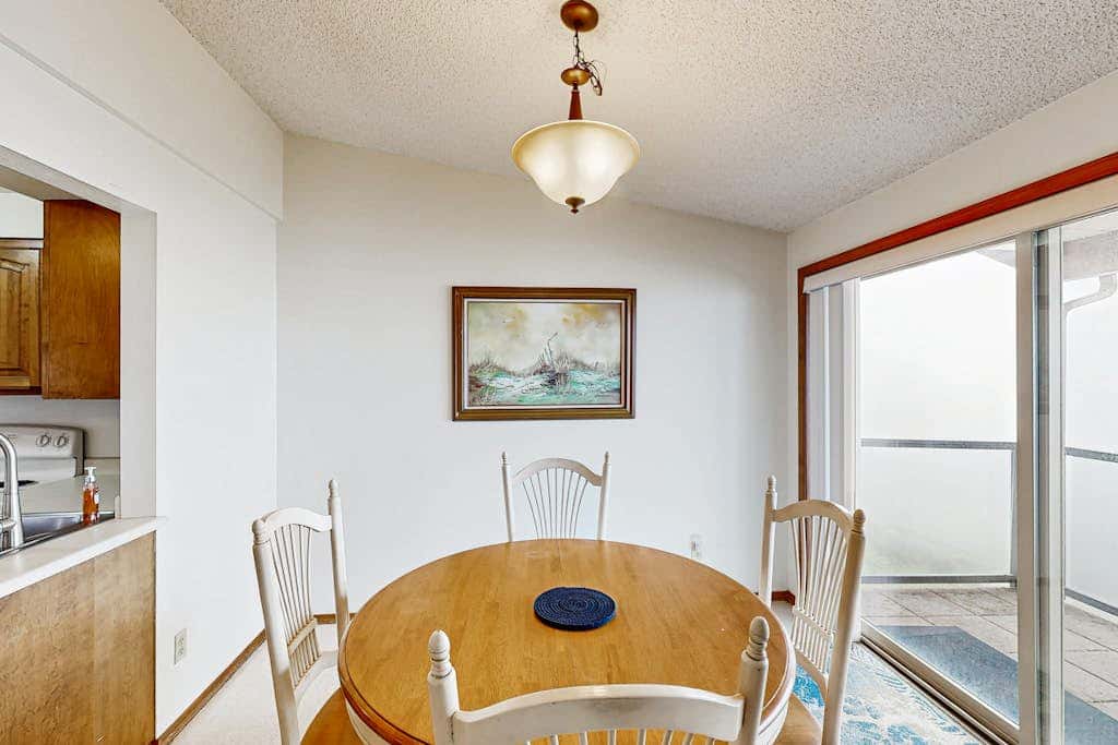 Sweeping Oceanfront Views Await Tranquil Condo with Balcony, Beach Access, W&D