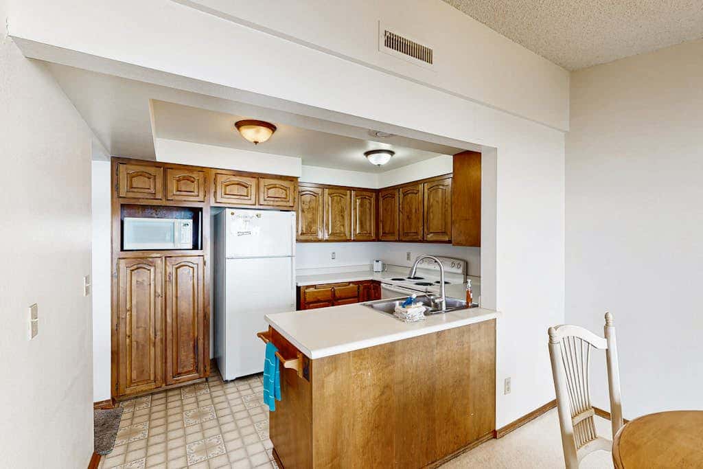 Sweeping Oceanfront Views Await Tranquil Condo with Balcony, Beach Access, W&D