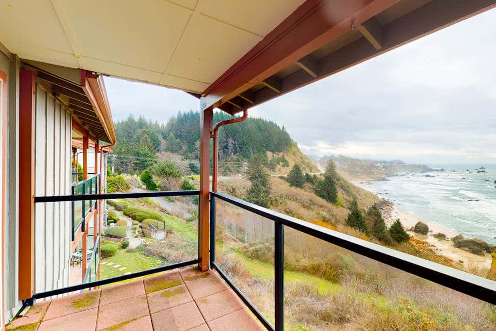 Sweeping Oceanfront Views Await Tranquil Condo with Balcony, Beach Access, W&D