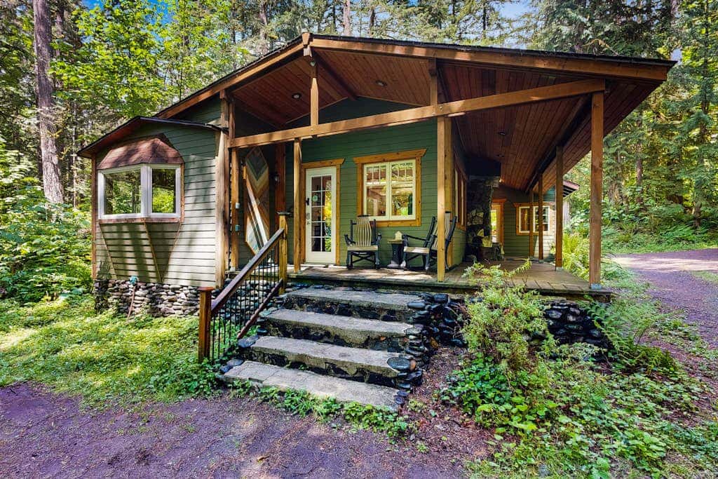 Cozy Riverfront Cottage with Charming Interior & Hot Tub - Dog-Friendly