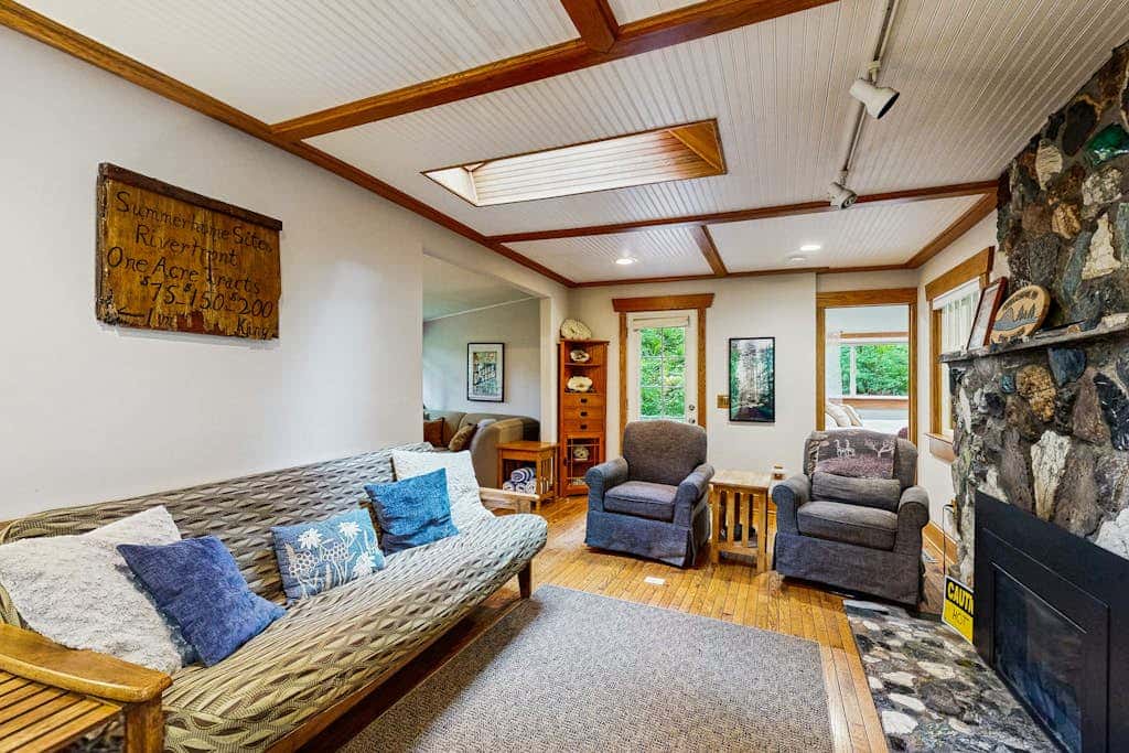 Cozy Riverfront Cottage with Charming Interior & Hot Tub - Dog-Friendly