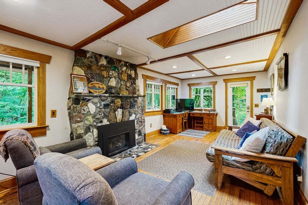 Cozy Riverfront Cottage with Charming Interior & Hot Tub - Dog-Friendly