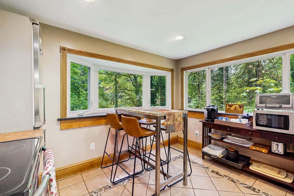 Cozy Riverfront Cottage with Charming Interior & Hot Tub - Dog-Friendly