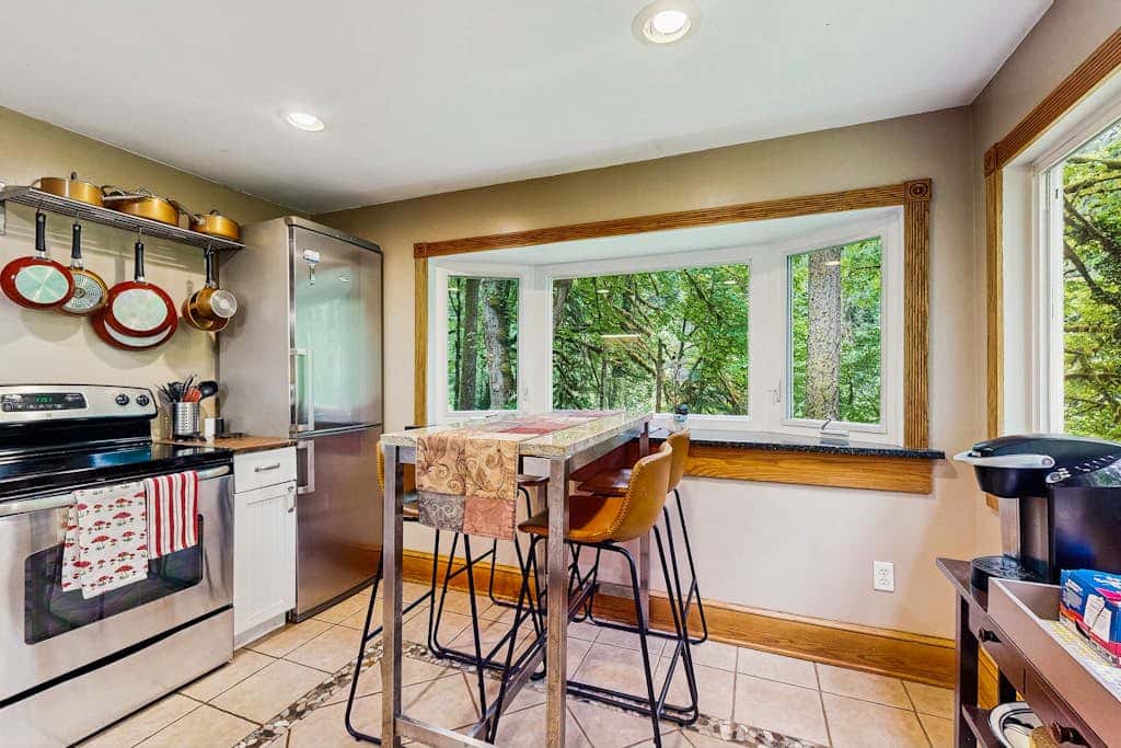 Cozy Riverfront Cottage with Charming Interior & Hot Tub - Dog-Friendly