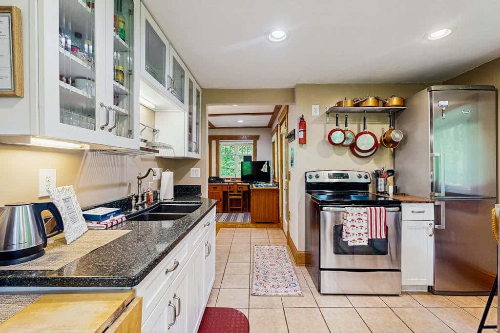Cozy Riverfront Cottage with Charming Interior & Hot Tub - Dog-Friendly