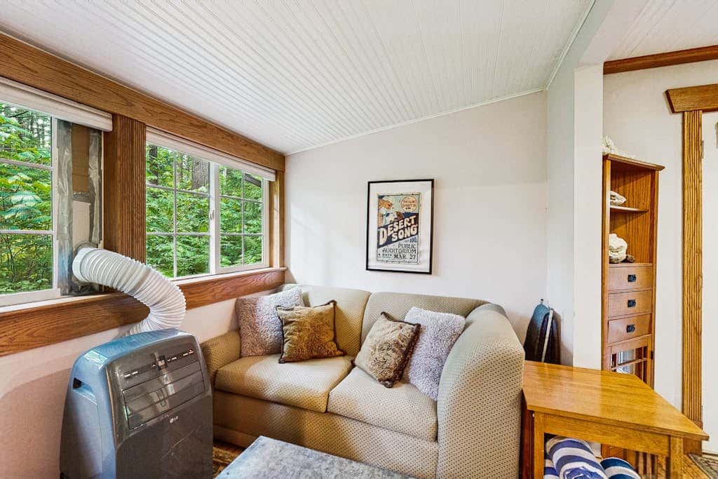 Cozy Riverfront Cottage with Charming Interior & Hot Tub - Dog-Friendly