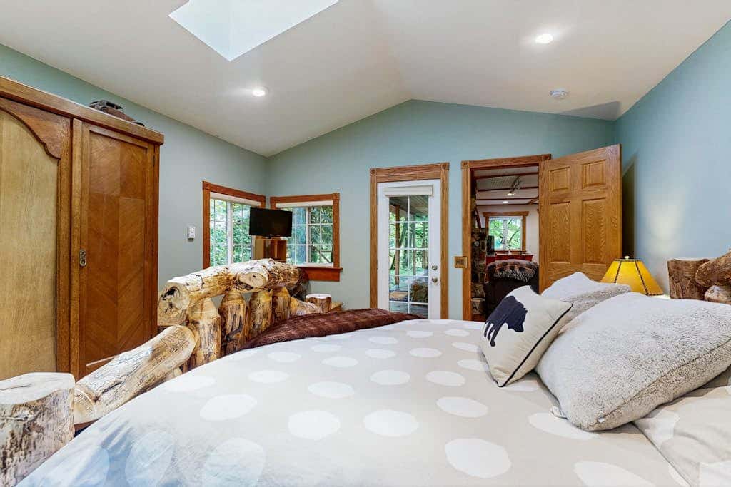 Cozy Riverfront Cottage with Charming Interior & Hot Tub - Dog-Friendly