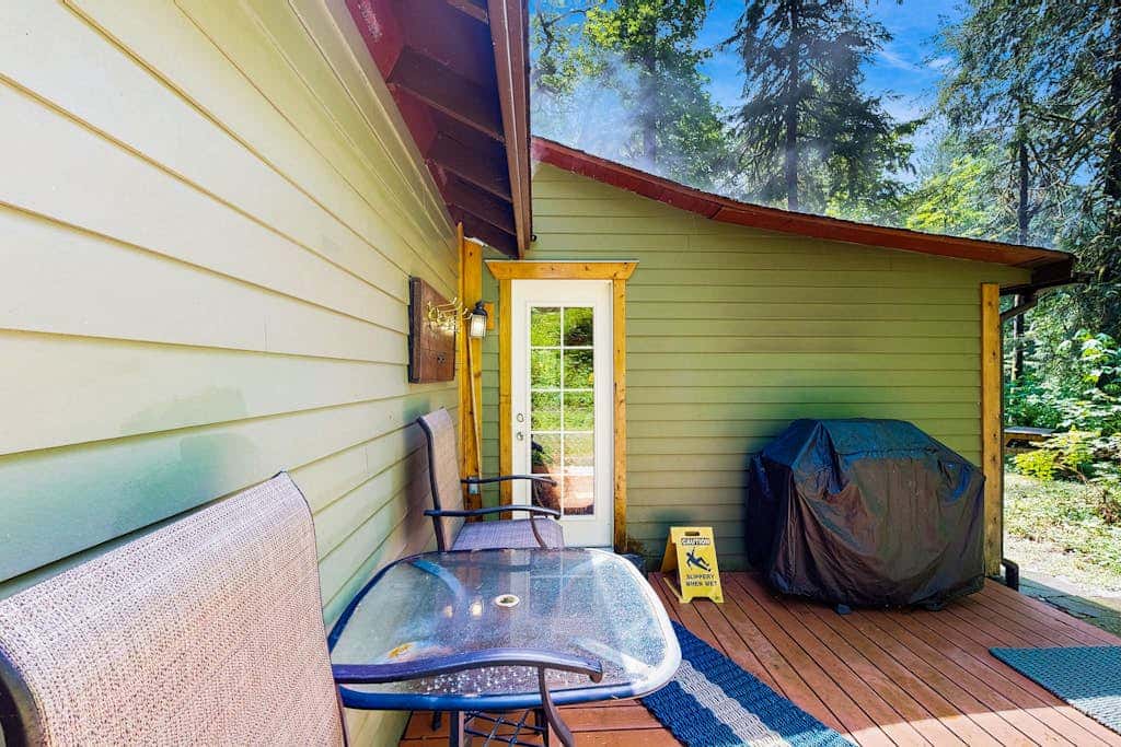 Cozy Riverfront Cottage with Charming Interior & Hot Tub - Dog-Friendly