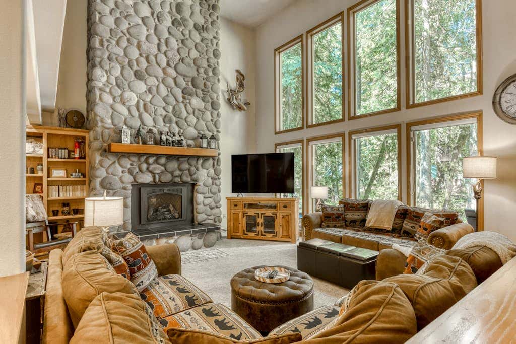 Classic riverfront home with great views, game room, hot tub, & modern cabin feel
