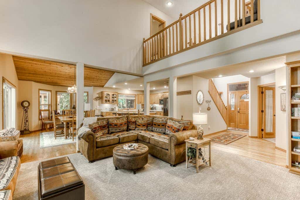 Classic riverfront home with great views, game room, hot tub, & modern cabin feel