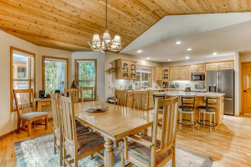 Classic riverfront home with great views, game room, hot tub, & modern cabin feel