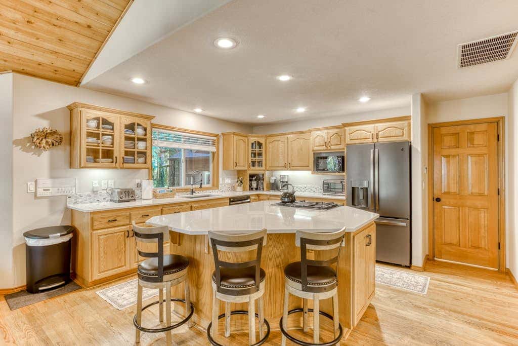 Classic riverfront home with great views, game room, hot tub, & modern cabin feel