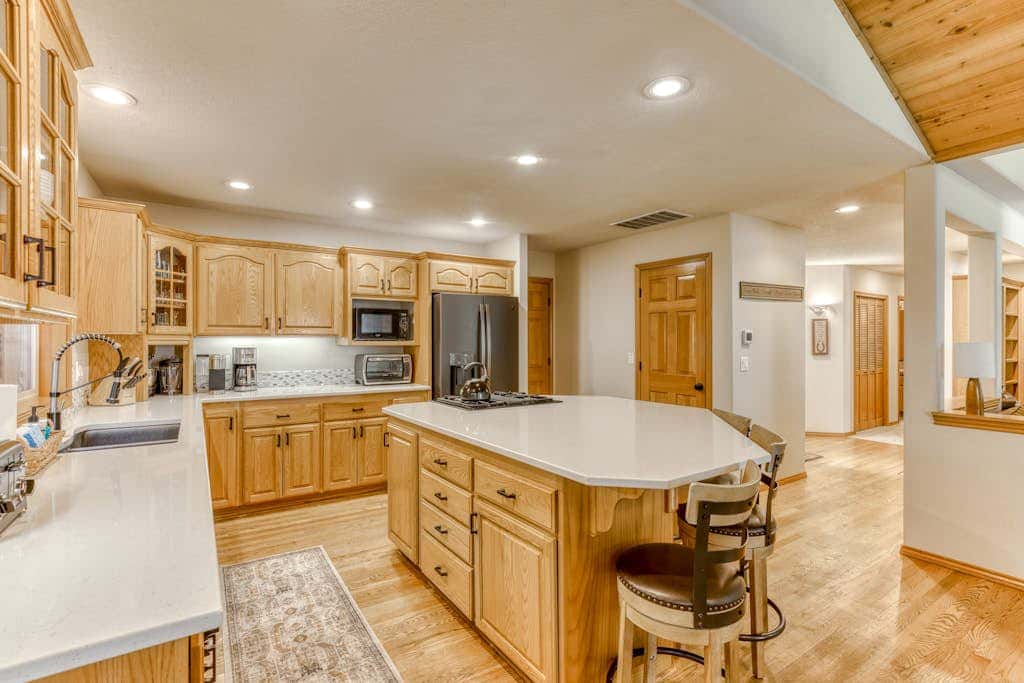 Classic riverfront home with great views, game room, hot tub, & modern cabin feel