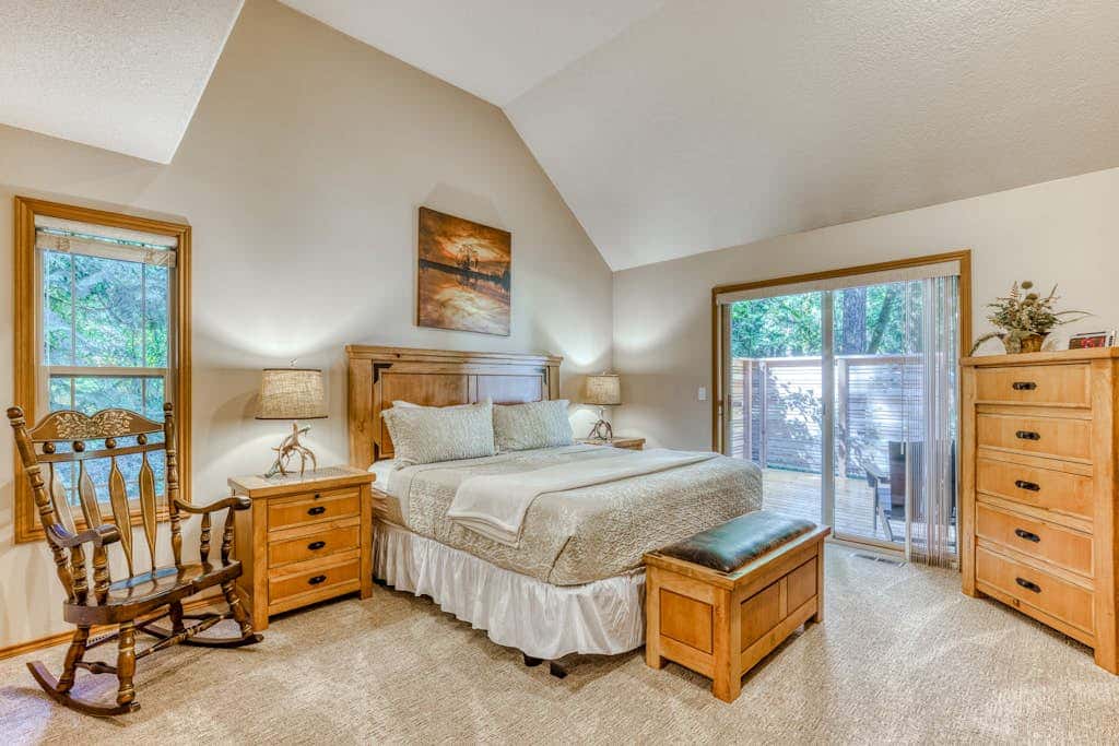 Classic riverfront home with great views, game room, hot tub, & modern cabin feel