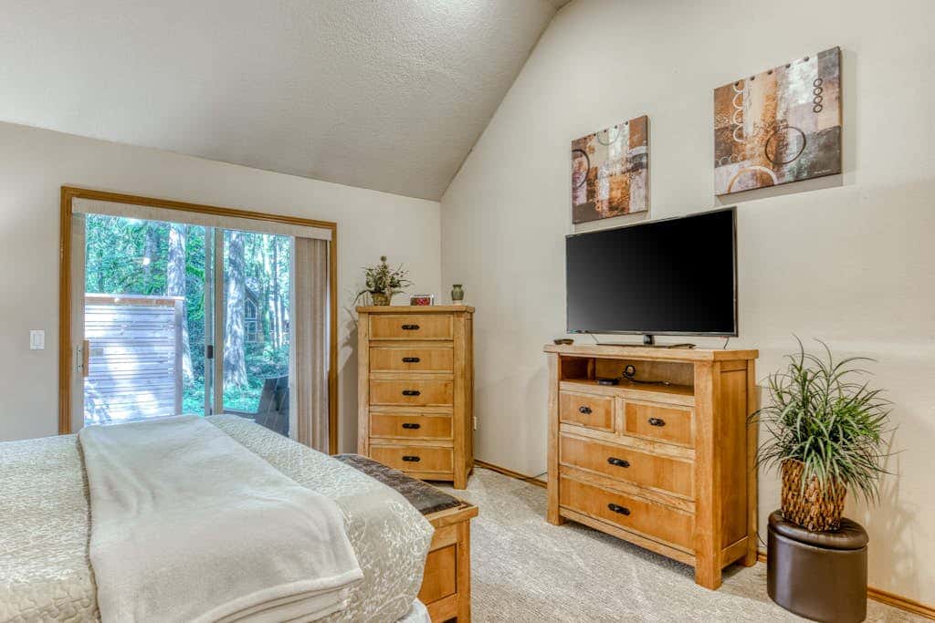 Classic riverfront home with great views, game room, hot tub, & modern cabin feel