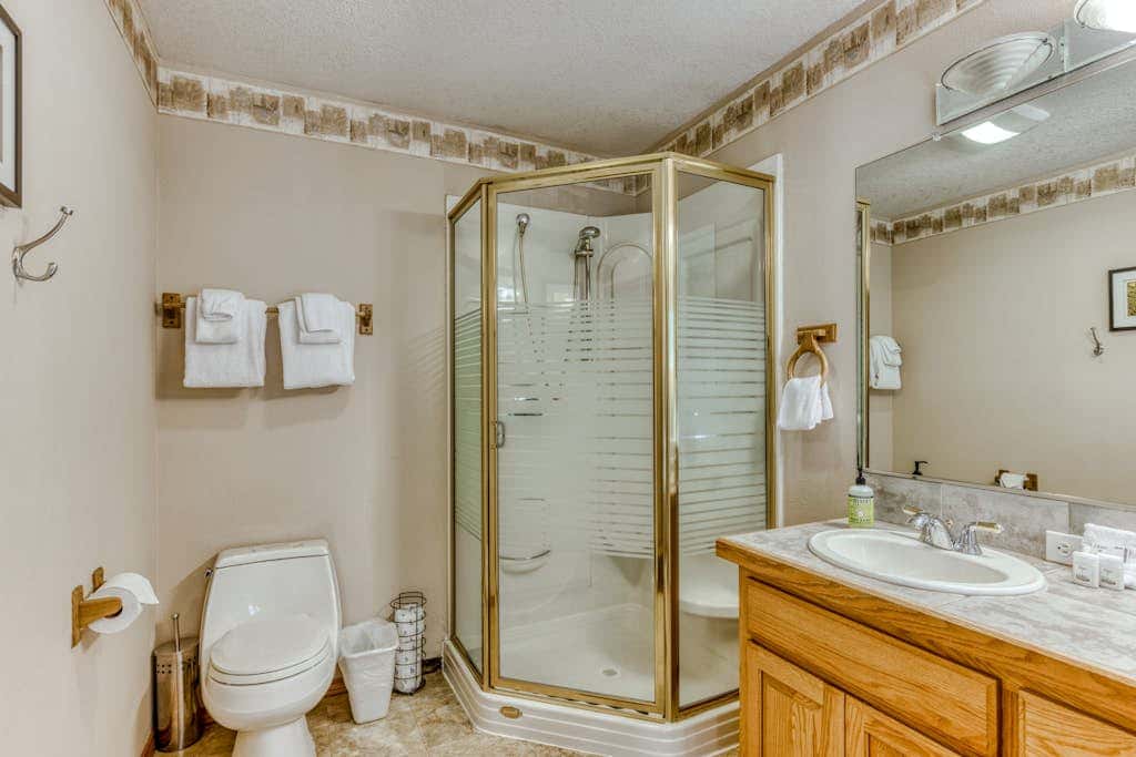 Classic riverfront home with great views, game room, hot tub, & modern cabin feel