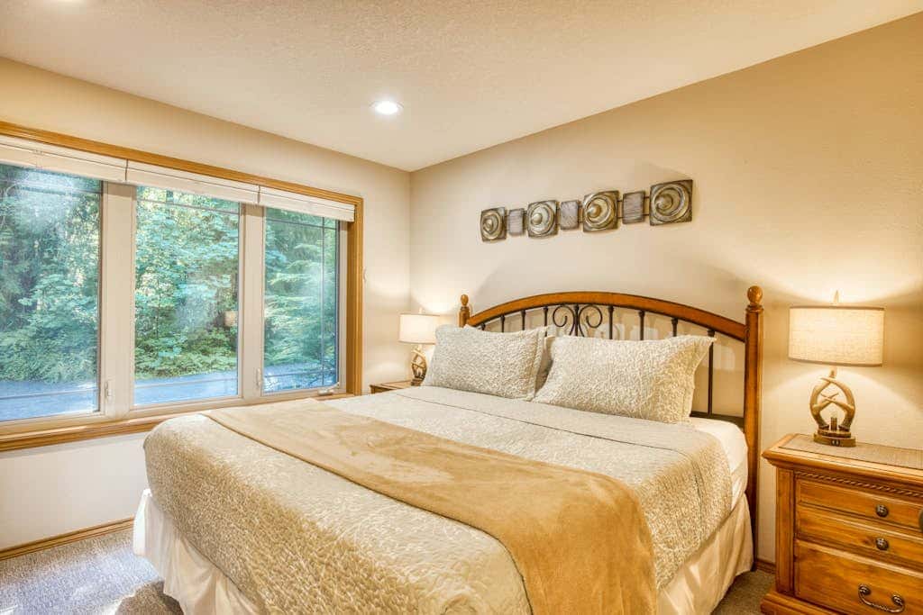 Classic riverfront home with great views, game room, hot tub, & modern cabin feel