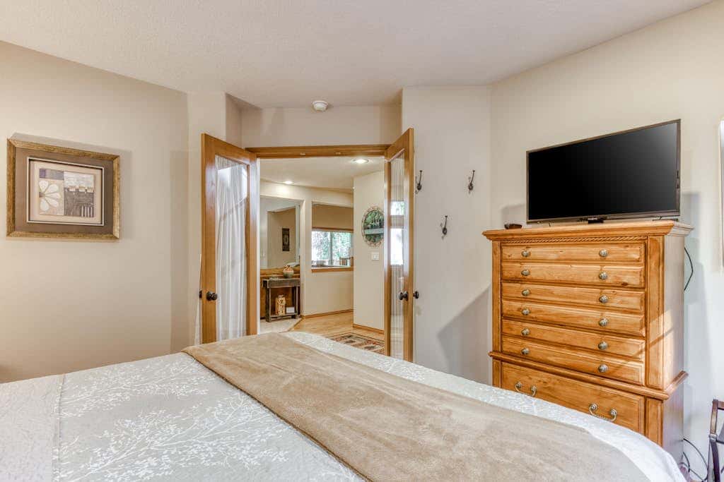 Classic riverfront home with great views, game room, hot tub, & modern cabin feel