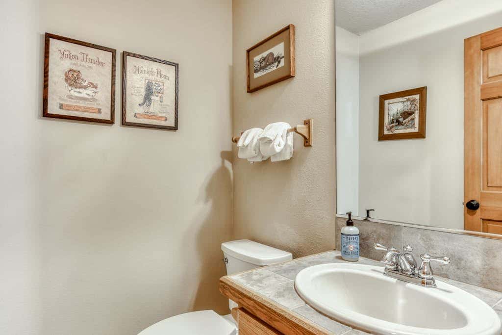 Classic riverfront home with great views, game room, hot tub, & modern cabin feel
