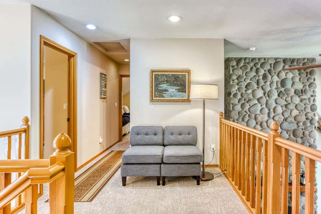 Classic riverfront home with great views, game room, hot tub, & modern cabin feel