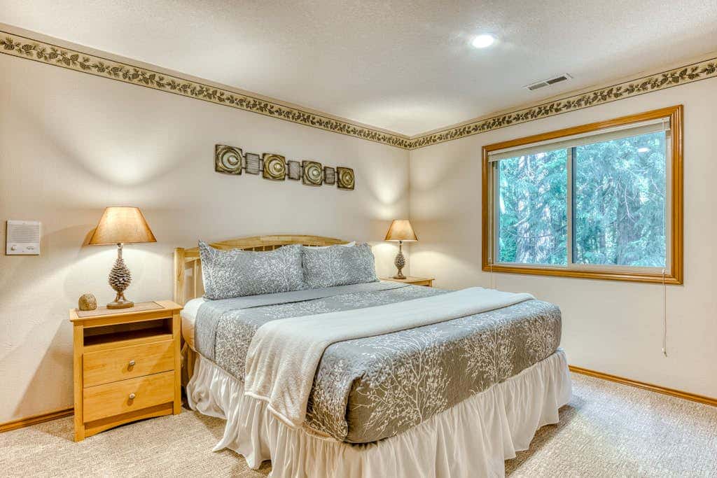 Classic riverfront home with great views, game room, hot tub, & modern cabin feel