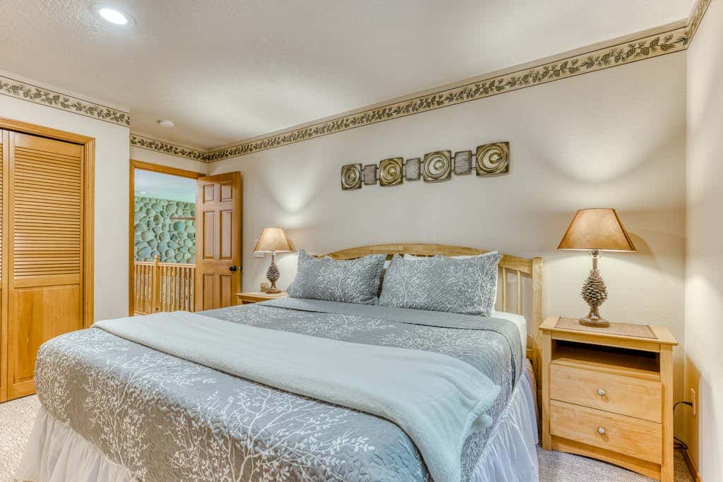 Classic riverfront home with great views, game room, hot tub, & modern cabin feel