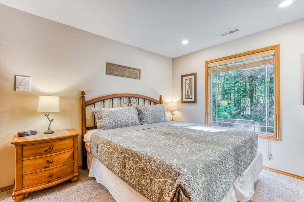 Classic riverfront home with great views, game room, hot tub, & modern cabin feel