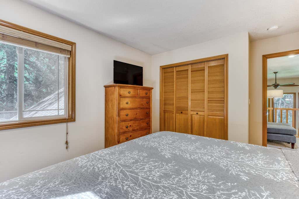 Classic riverfront home with great views, game room, hot tub, & modern cabin feel