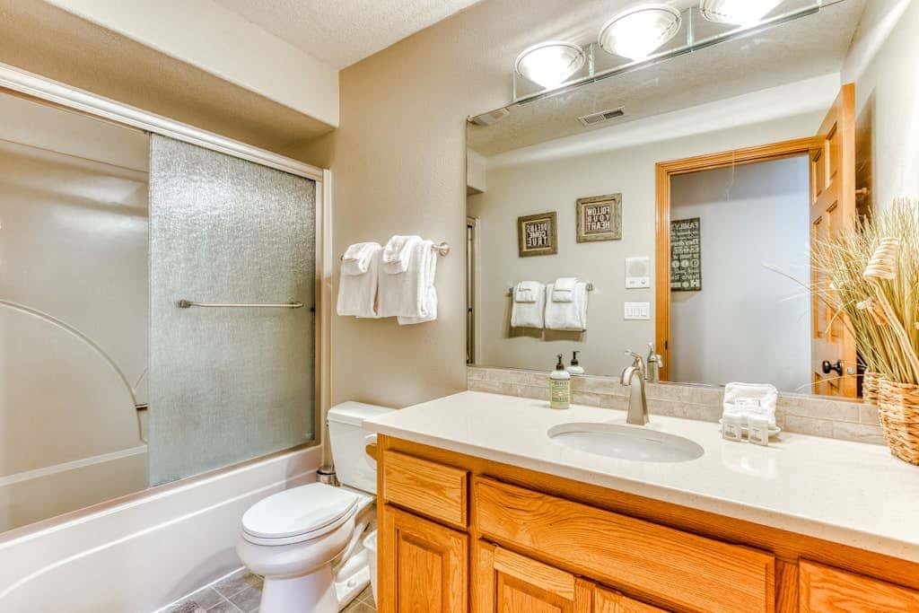 Classic riverfront home with great views, game room, hot tub, & modern cabin feel