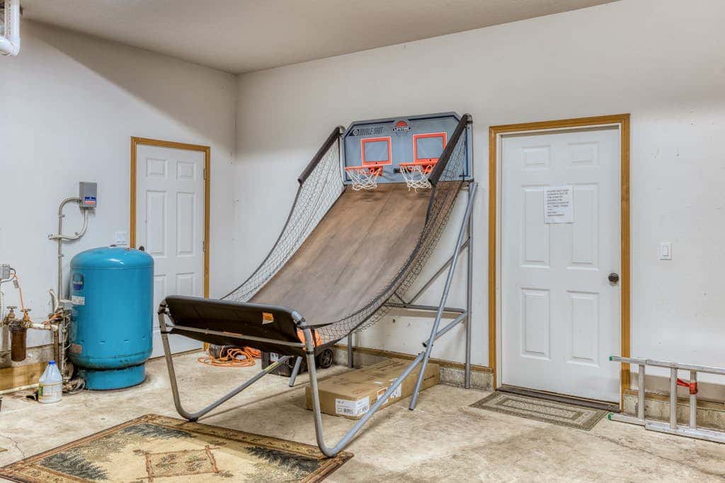 Classic riverfront home with great views, game room, hot tub, & modern cabin feel