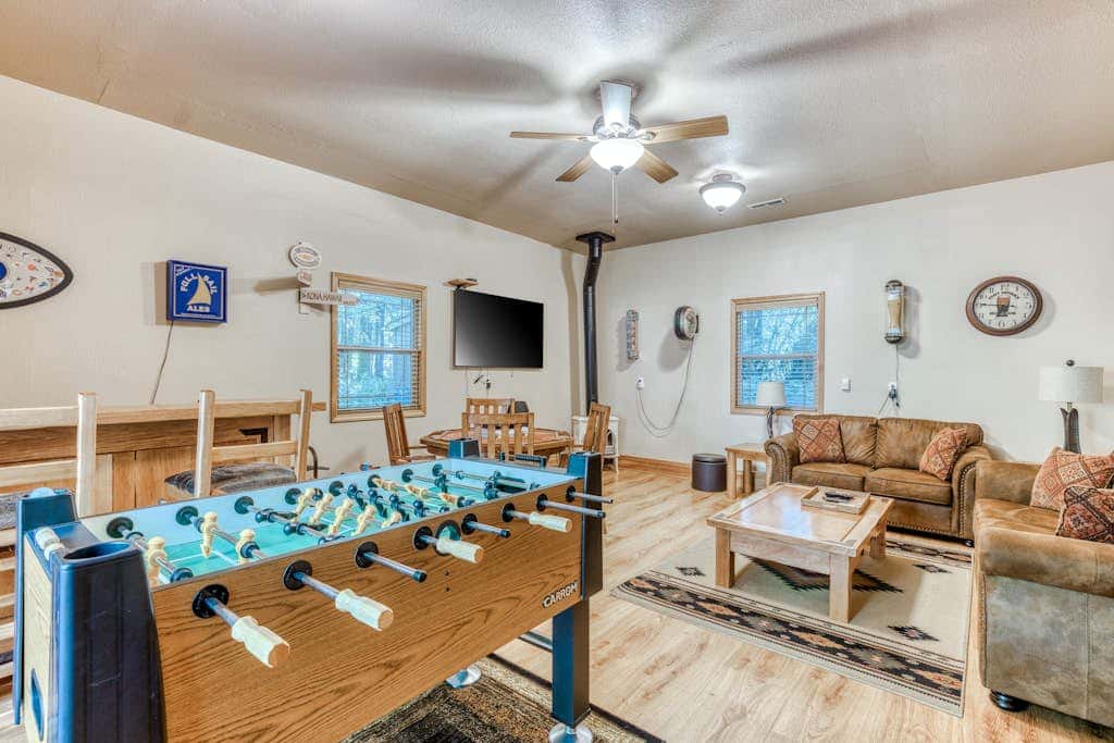 Classic riverfront home with great views, game room, hot tub, & modern cabin feel