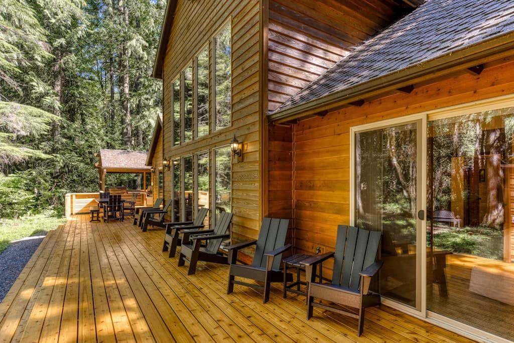 Classic riverfront home with great views, game room, hot tub, & modern cabin feel