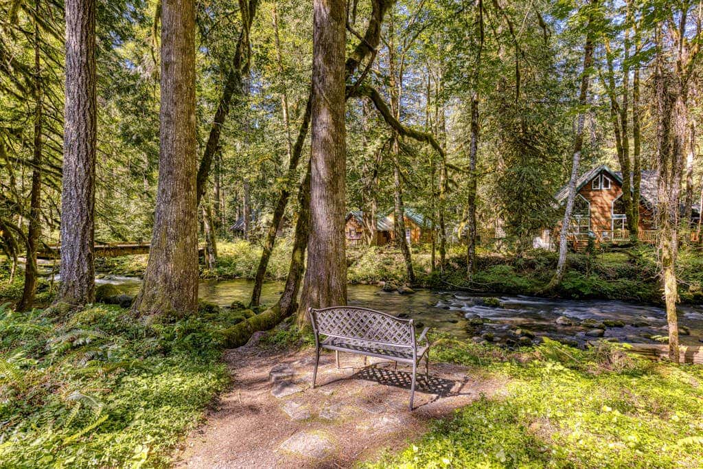 Classic riverfront home with great views, game room, hot tub, & modern cabin feel