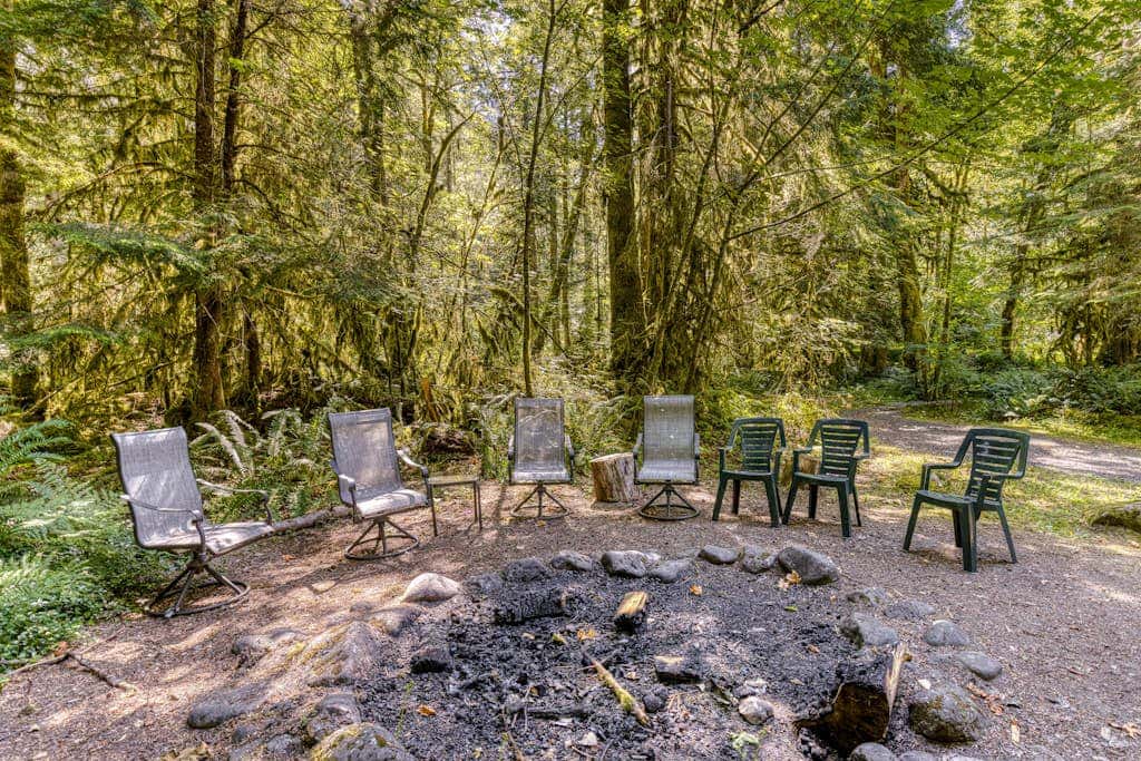 Classic riverfront home with great views, game room, hot tub, & modern cabin feel