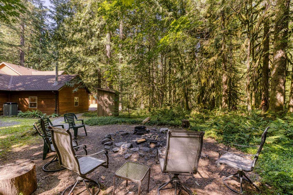 Classic riverfront home with great views, game room, hot tub, & modern cabin feel