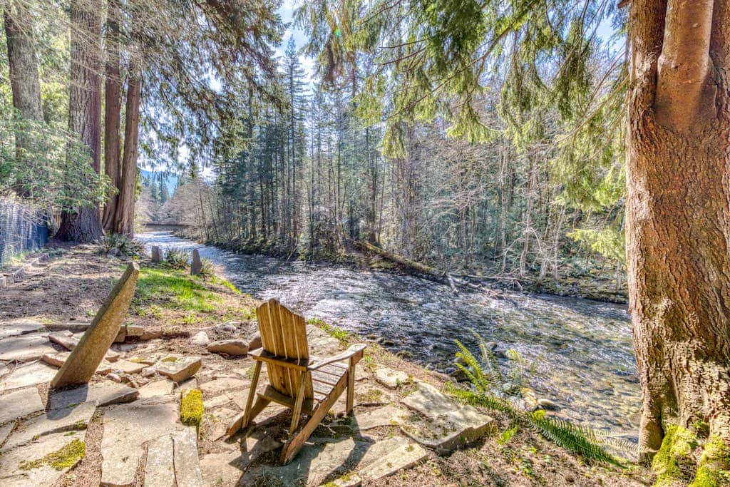 Dog-friendly, riverfront home with a wood-burning fireplace & views