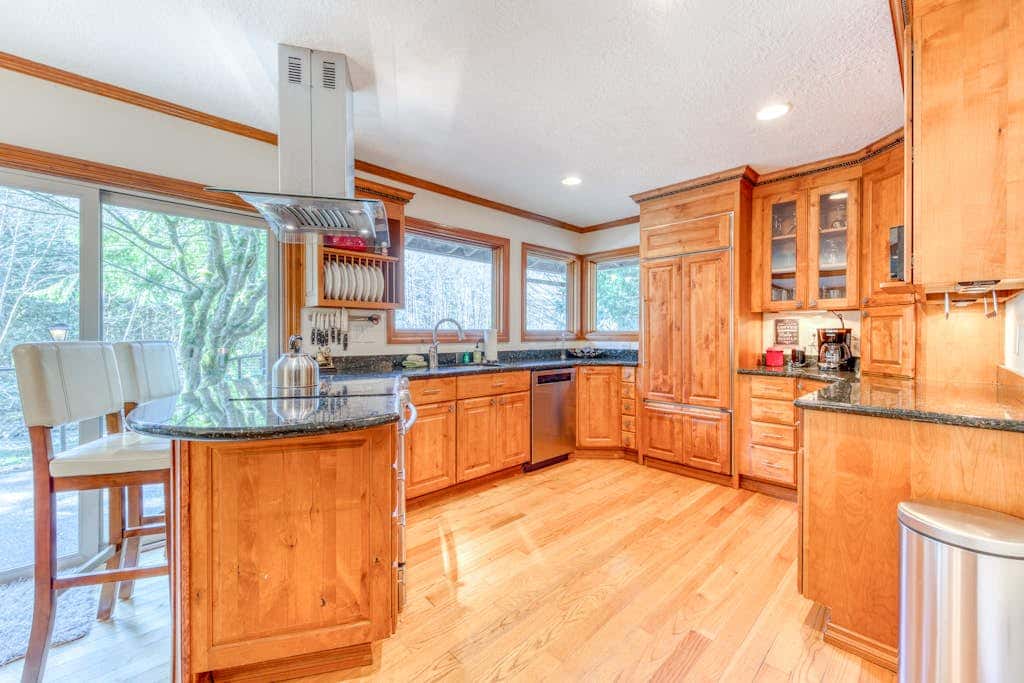 Dog-friendly, riverfront home with a wood-burning fireplace & views