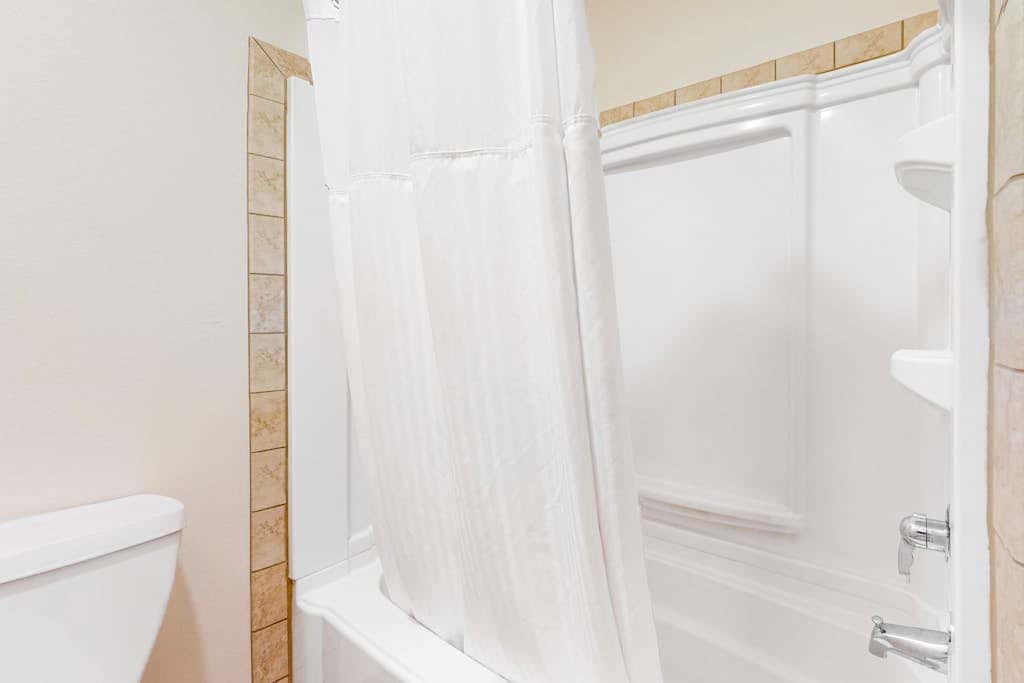 Mountain view condo with a fireplace, WiFi, partial AC, shared hot tub & pool
