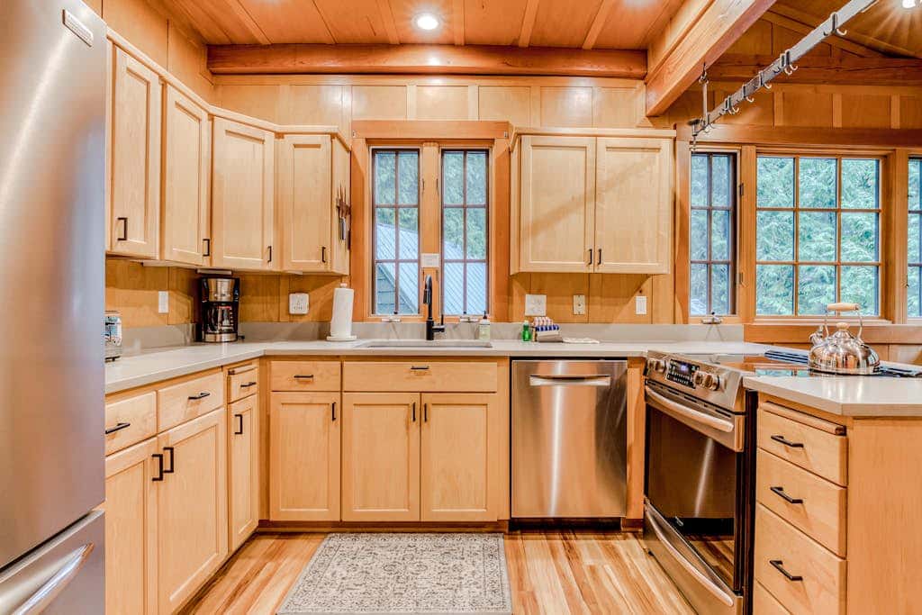 Classic forest cabin on Still Creek with private hot tub & wood fireplace