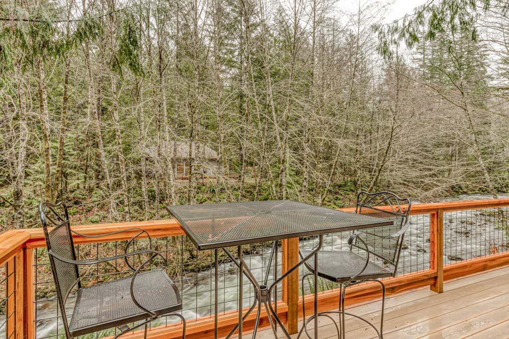 Classic forest cabin on Still Creek with private hot tub & wood fireplace