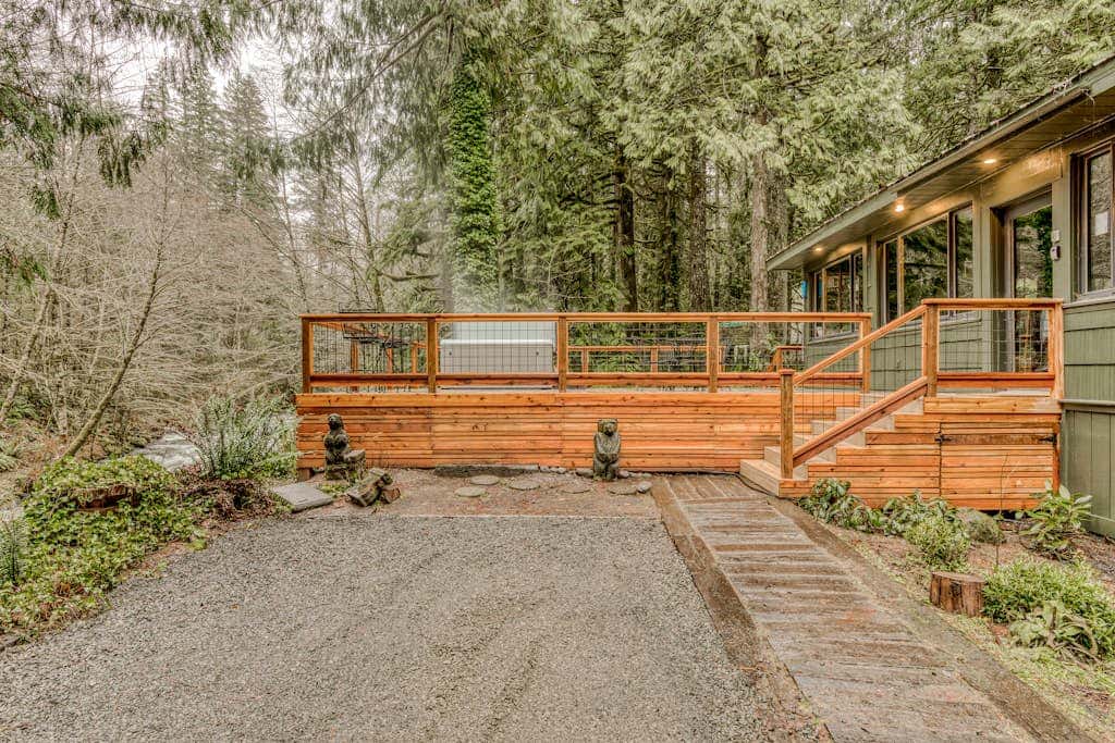 Classic forest cabin on Still Creek with private hot tub & wood fireplace