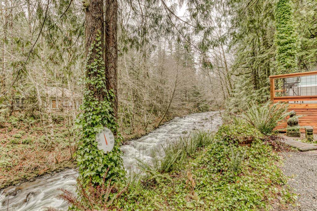 Classic forest cabin on Still Creek with private hot tub & wood fireplace