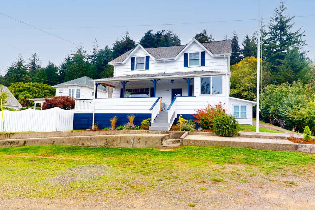 Spacious home with river views, hot tub, covered porch, deck, grill, & W&D
