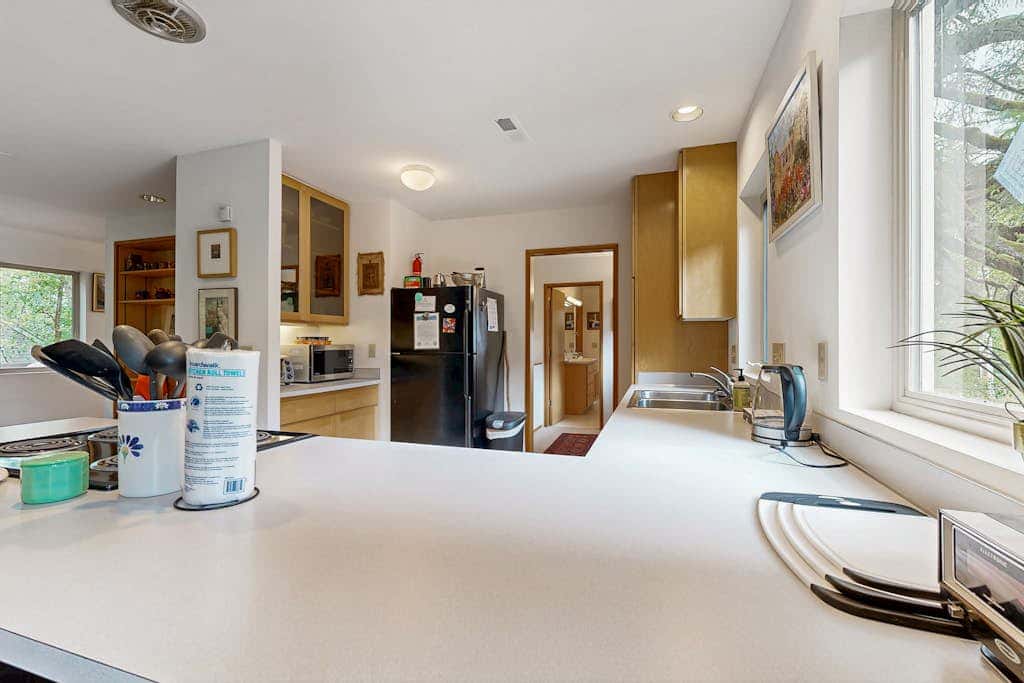 Forest-view home with fireplace, deck - Walk to the Beach & Golf Course
