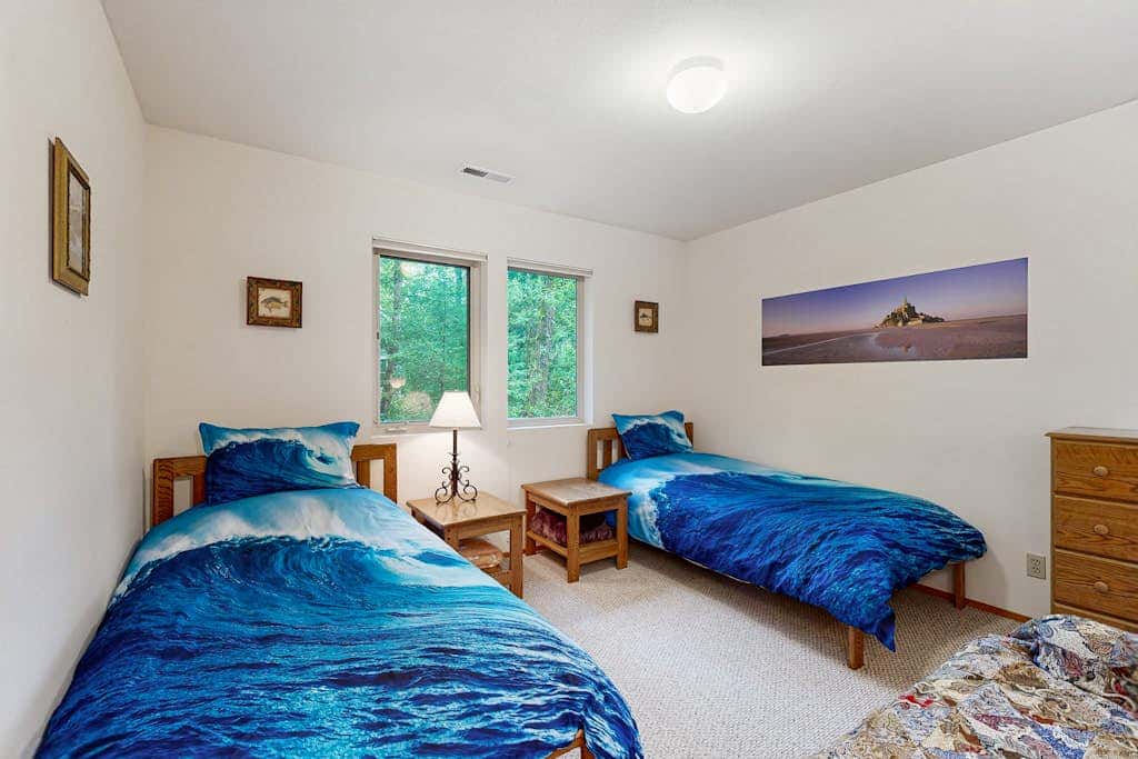 Forest-view home with fireplace, deck - Walk to the Beach & Golf Course